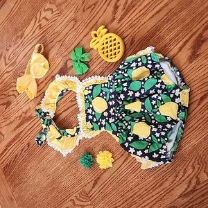 12/18 month lemon bubble suit. With 3 hair clips,teether and a headband